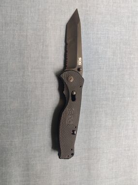 SOG Black Folding Knife with Partially Serrated Tanto Blade